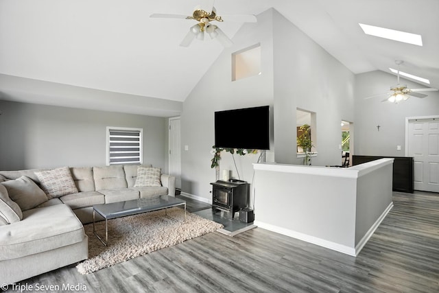 28629 W Ravine Dr, Barrington, IL 60010 - living room featuring ceiling fan, high vaulted ceiling, wood finished floors, a wood stove, and a skylight