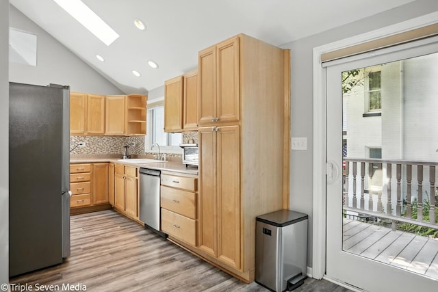 28629 W Ravine Dr, Barrington, IL 60010 - kitchen with appliances with stainless steel finishes, a skylight, open shelves, light brown cabinets, and lofted ceiling