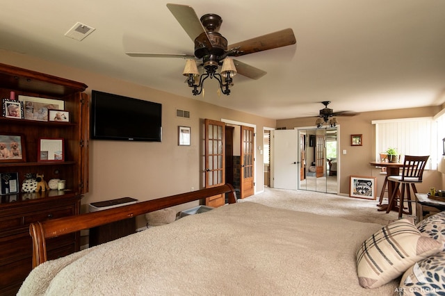 interior space featuring ceiling fan and french doors