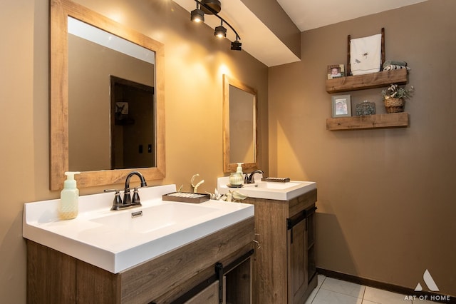 bathroom featuring tile patterned flooring and vanity