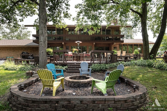 view of patio featuring a deck and an outdoor fire pit