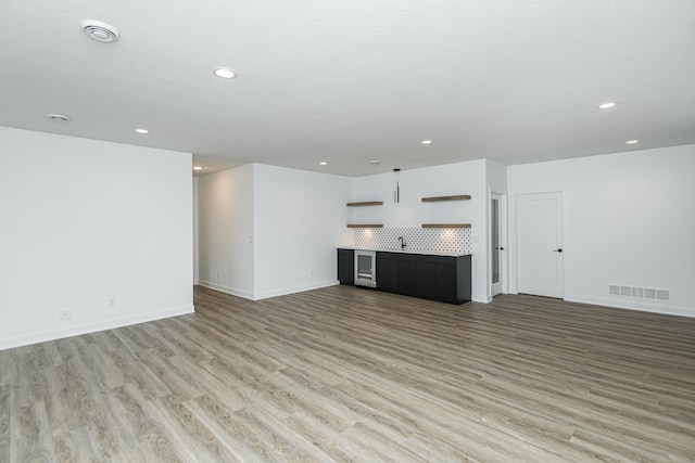 unfurnished living room with light wood-type flooring