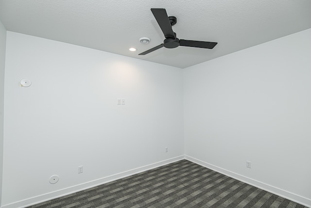 spare room featuring ceiling fan and a textured ceiling