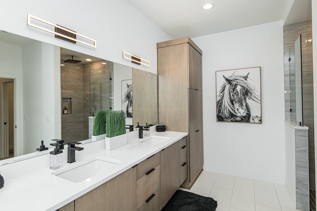 bathroom with tile patterned flooring, a shower with door, and double sink vanity