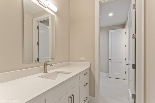 bathroom featuring tile patterned floors and vanity