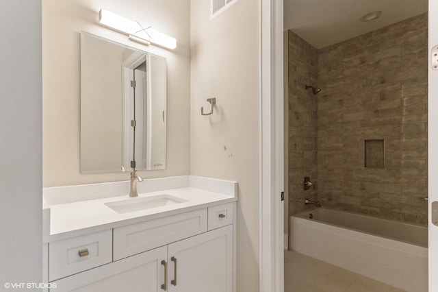 bathroom featuring shower / bath combination and vanity