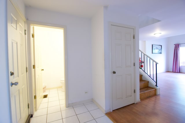 corridor with light hardwood / wood-style flooring