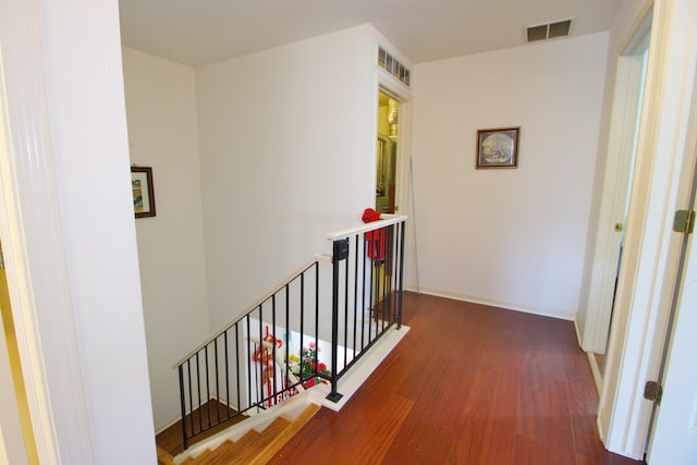 corridor featuring dark wood-type flooring