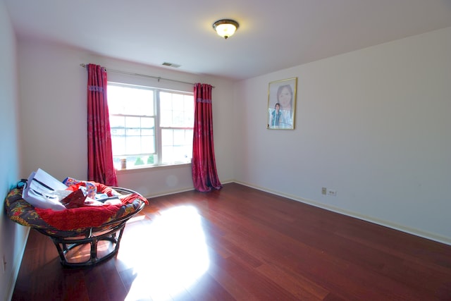 sitting room with dark hardwood / wood-style floors