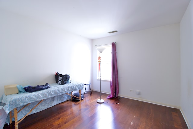 bedroom featuring dark hardwood / wood-style flooring