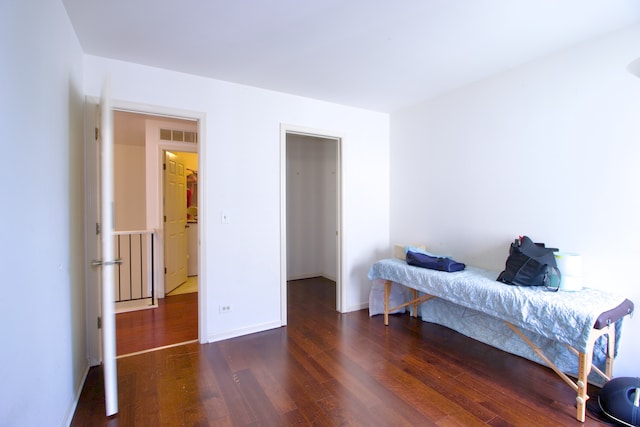 bedroom featuring dark hardwood / wood-style flooring