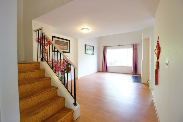 staircase featuring hardwood / wood-style floors