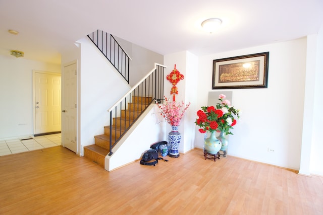 stairs with wood-type flooring