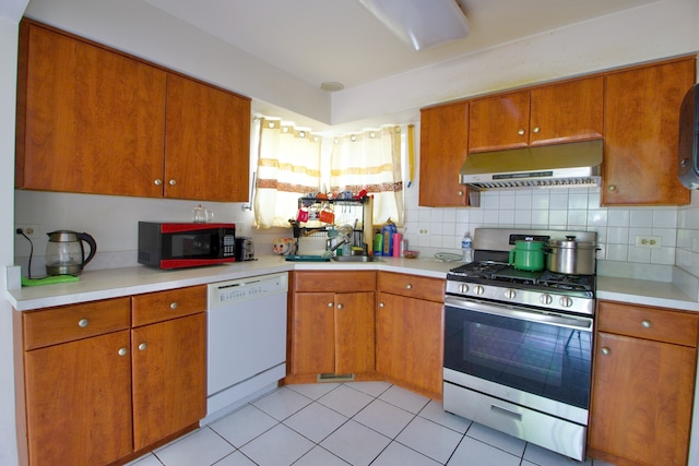 kitchen with dishwasher, backsplash, stainless steel gas stove, and light tile patterned floors