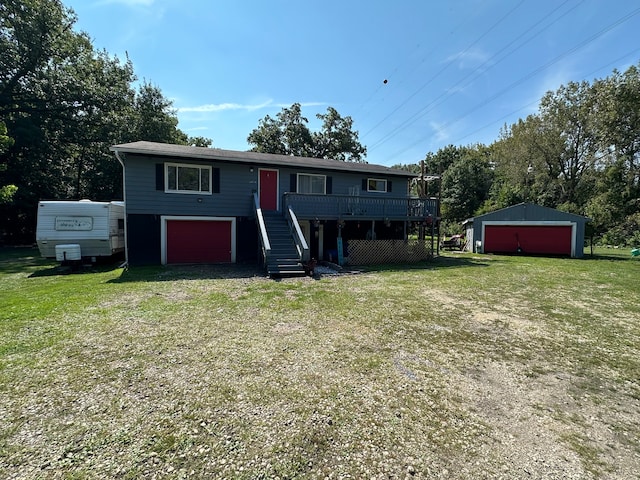 view of front of home with driveway, stairs, a garage, and a front lawn