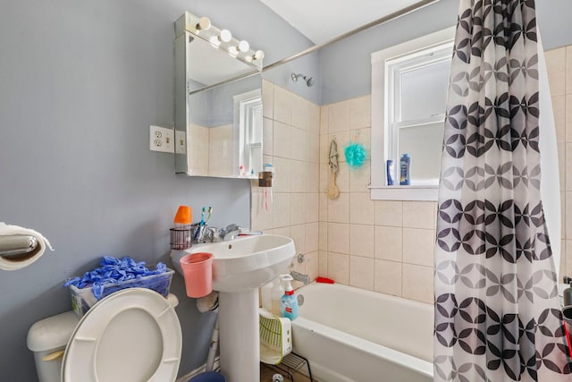 full bath featuring shower / bath combo and toilet