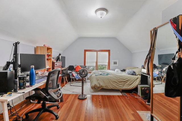 bedroom featuring vaulted ceiling and hardwood / wood-style floors
