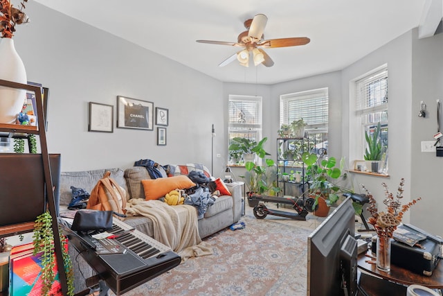 living area with a ceiling fan