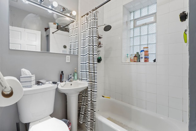 bathroom with toilet and shower / bath combo with shower curtain