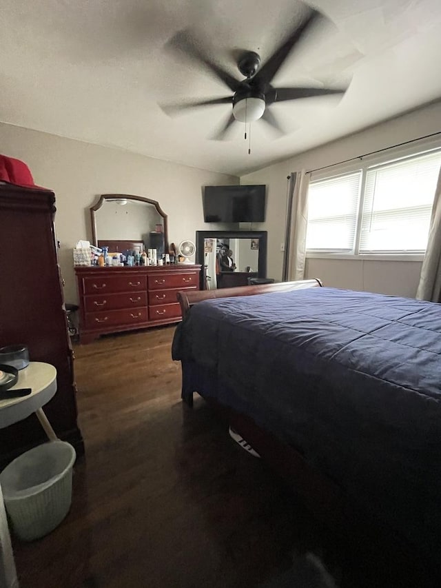 bedroom featuring a ceiling fan and dark wood finished floors