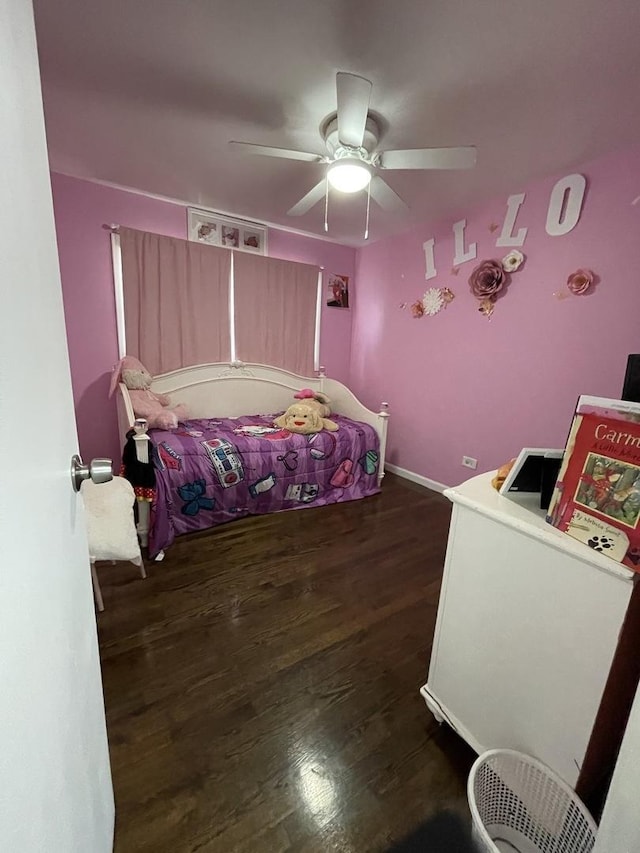 bedroom featuring dark wood finished floors and a ceiling fan