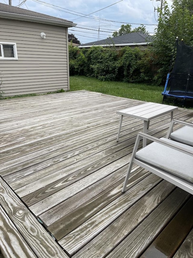 wooden terrace featuring a trampoline