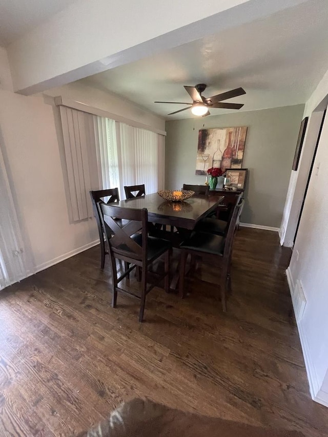 dining space with ceiling fan, dark wood finished floors, and baseboards