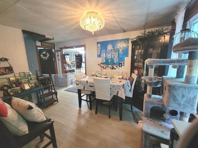 dining room with a notable chandelier and hardwood / wood-style flooring