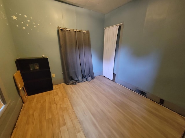 empty room featuring hardwood / wood-style floors