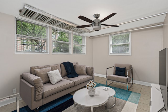 tiled living room with ceiling fan