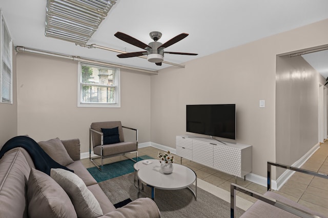 tiled living room featuring ceiling fan