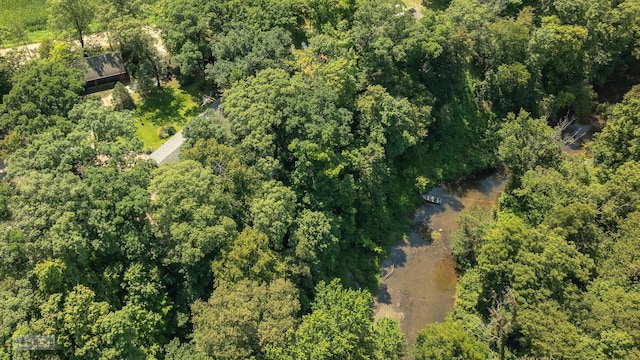 birds eye view of property with a wooded view