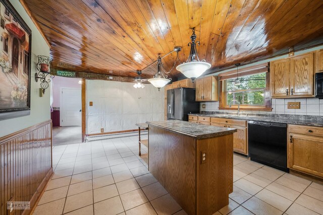 kitchen featuring appliances with stainless steel finishes, a kitchen island, light tile patterned floors, and wood ceiling