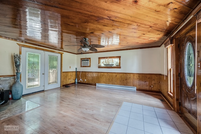 foyer entrance featuring light hardwood / wood-style floors, french doors, crown molding, ceiling fan, and baseboard heating