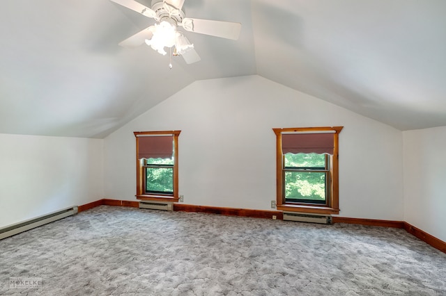 bonus room with a wealth of natural light, carpet flooring, ceiling fan, and vaulted ceiling