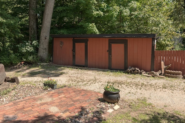 view of shed with fence