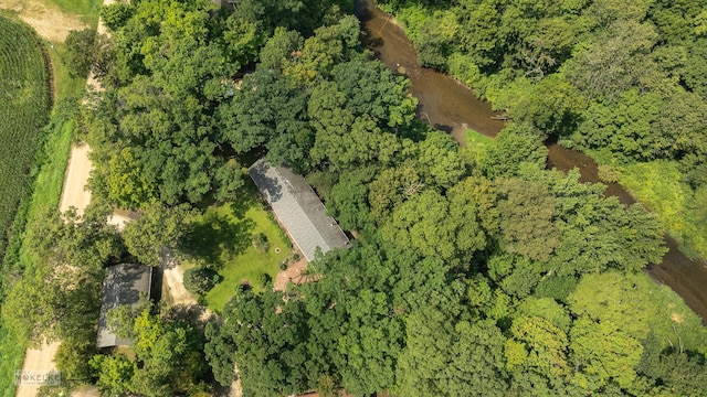 birds eye view of property with a wooded view