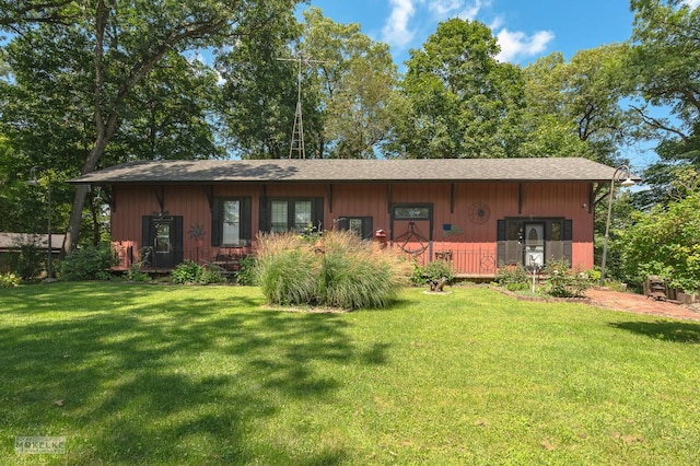 rear view of house with a lawn