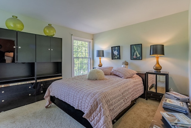 bedroom with light carpet