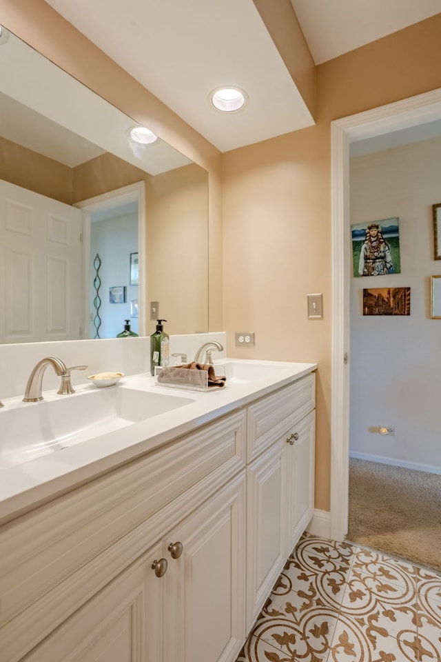 bathroom with tile patterned floors and vanity