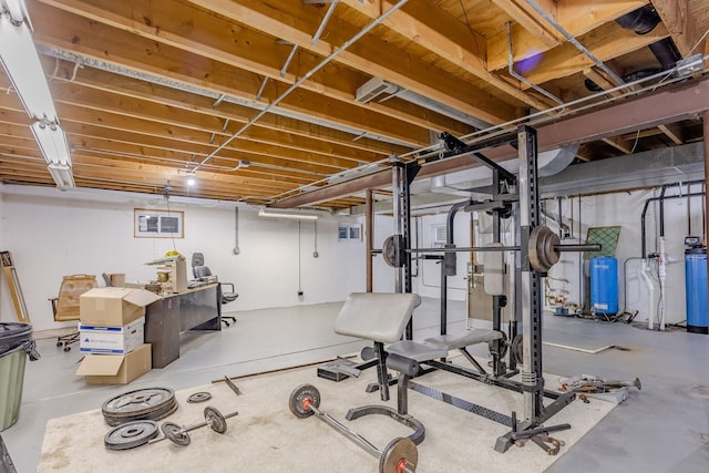 exercise room featuring concrete flooring