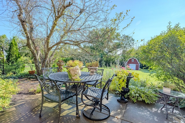 view of patio / terrace with a storage shed