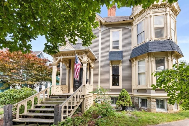 view of front facade with a chimney