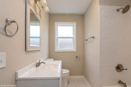 full bathroom with shower / bathtub combination, vanity, toilet, and baseboards