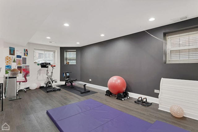 workout room with wood-type flooring