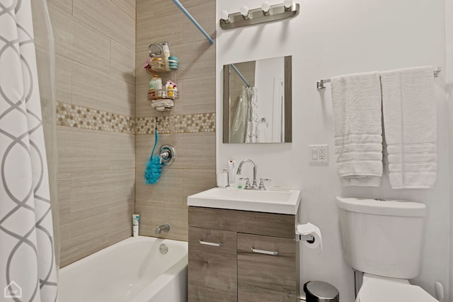 full bathroom featuring shower / bath combo with shower curtain, vanity, and toilet