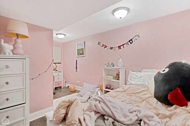 bedroom with light hardwood / wood-style flooring