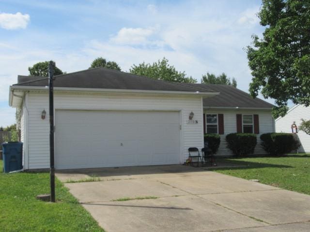 ranch-style home with concrete driveway, a front lawn, and an attached garage