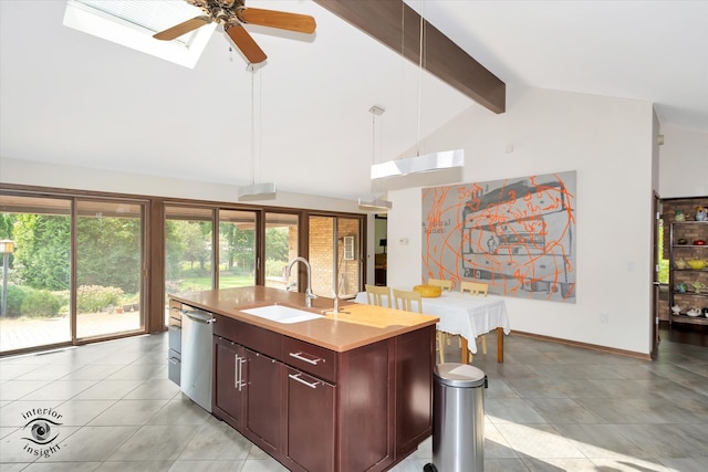 kitchen with beamed ceiling, dishwasher, a kitchen island with sink, sink, and ceiling fan