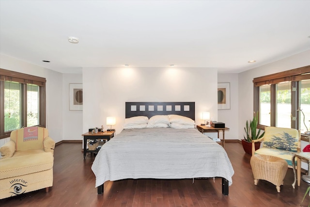 bedroom with dark wood-type flooring